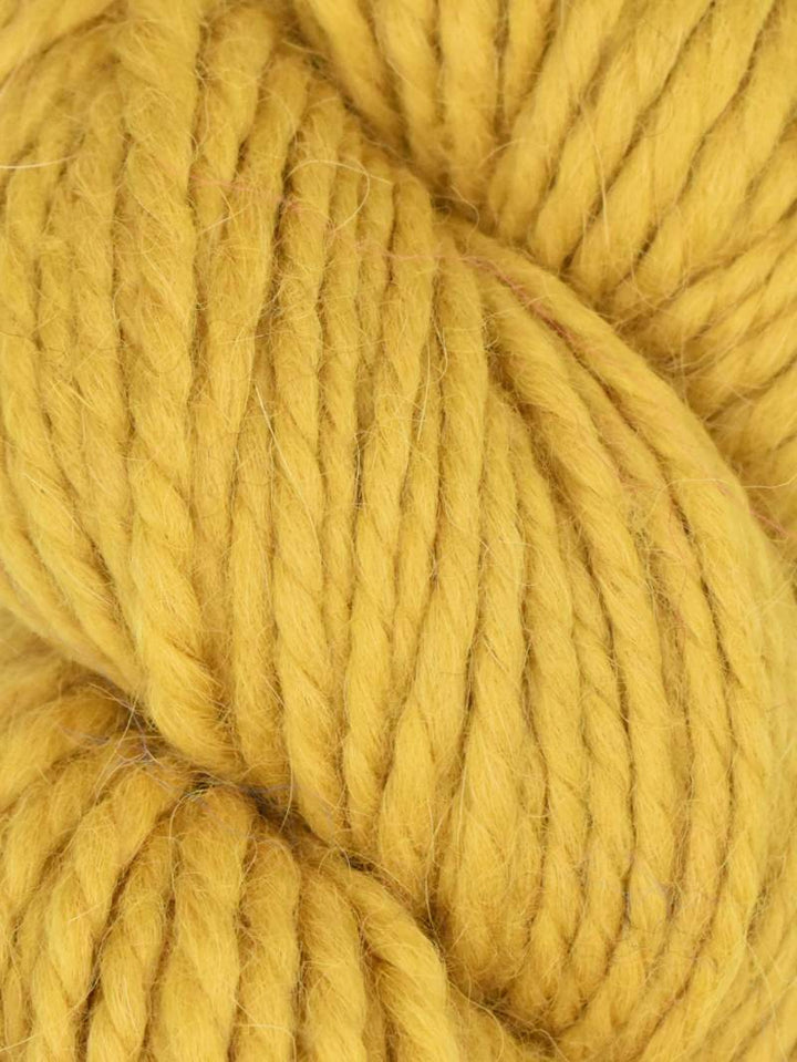 Close-up of yellow yarn with a focus on texture and color.