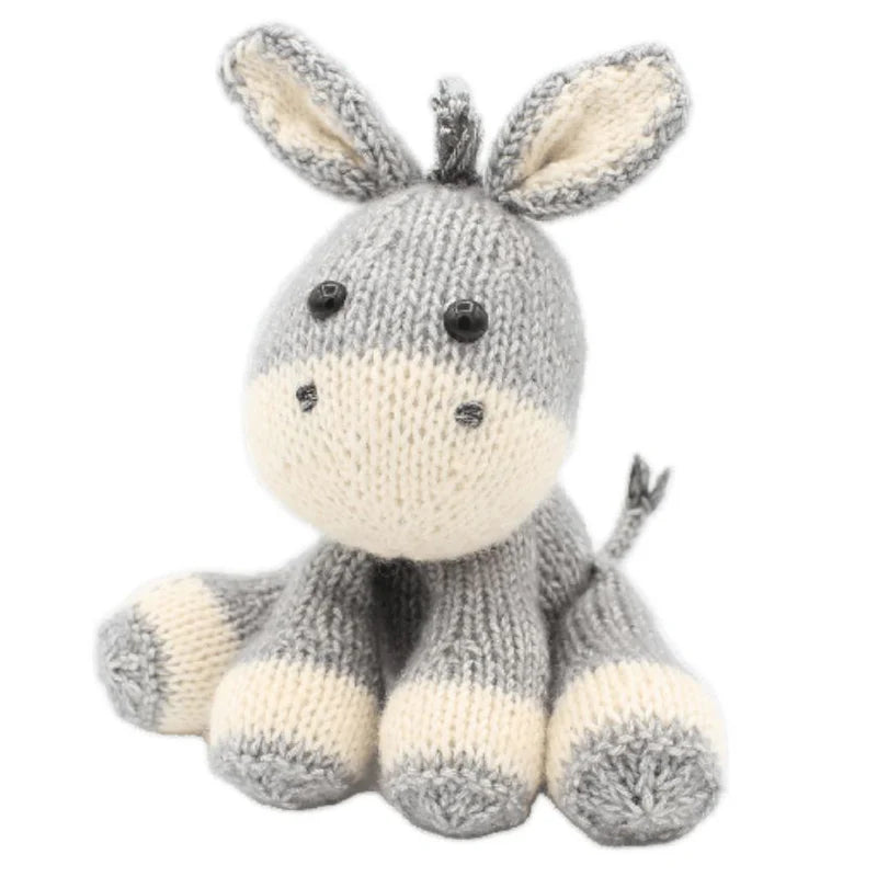 Knitted donkey toy on a white background