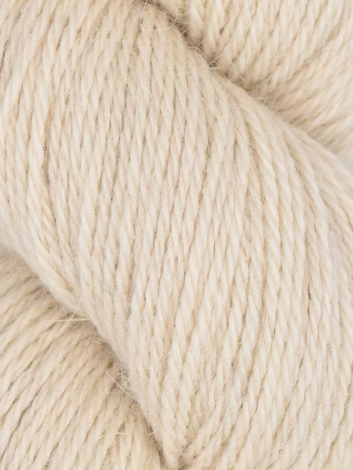 Close-up of beige yarn with a soft texture