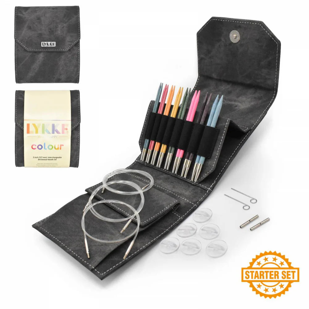 LYkke knitting needle set with various needles and accessories in a black case on a white background.
