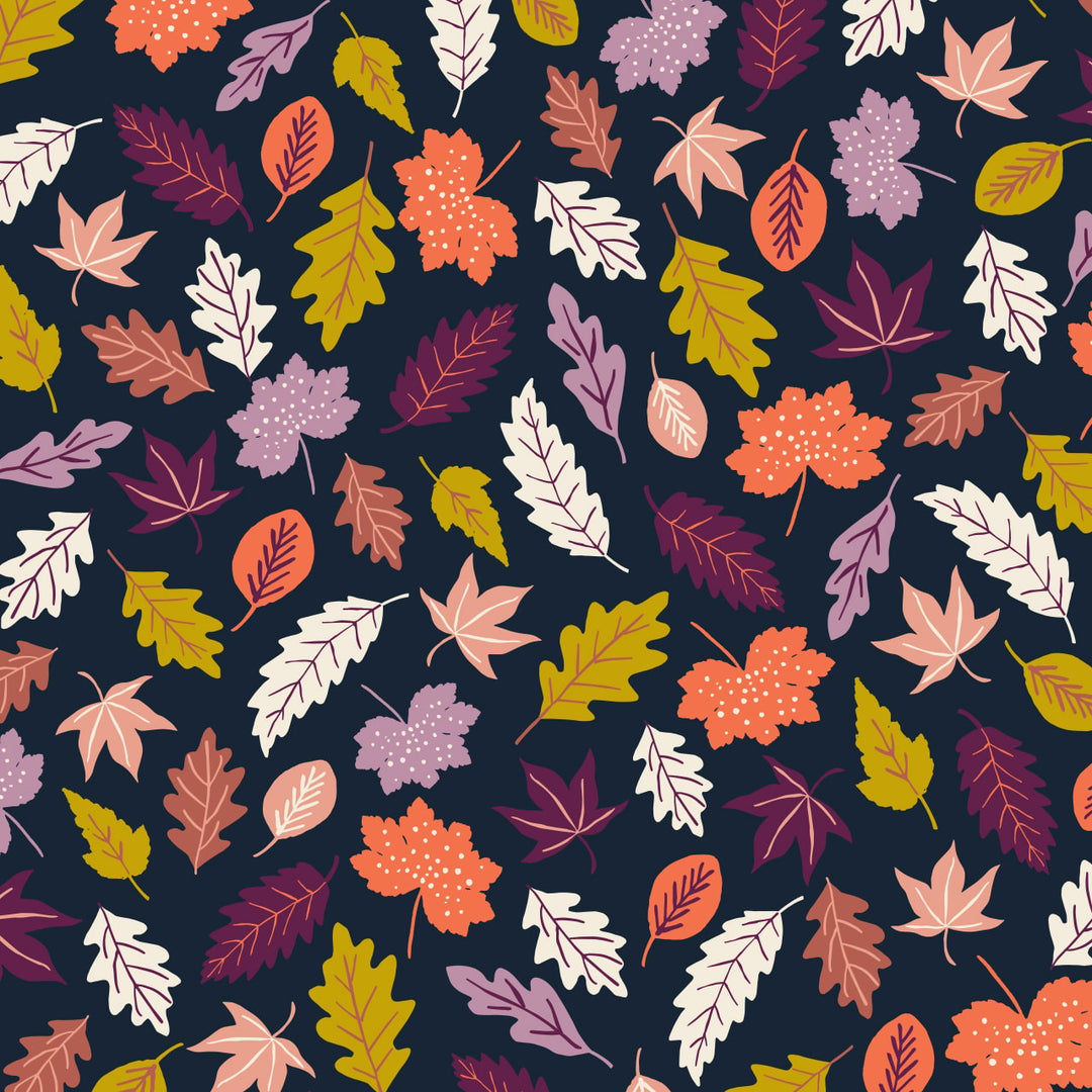 fabric with a navy background and brightly colored leaves