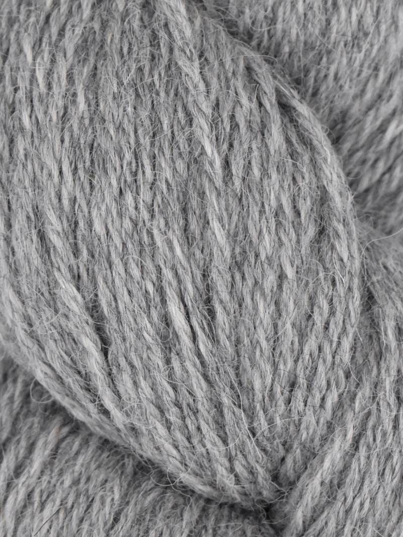 Close-up of gray yarn with a focus on texture