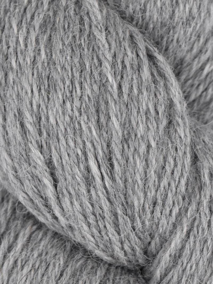 Close-up of gray yarn with a focus on texture