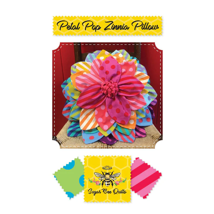 Colorful flower-shaped pillow with 'Sugar Bee Quilts' branding on a white background