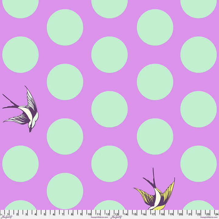 Fabric with bright purple background, large turquoise dots, and birds flying