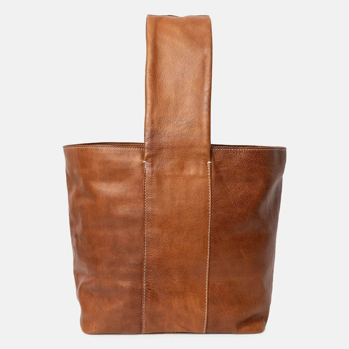 Brown leather tote bag on a white background