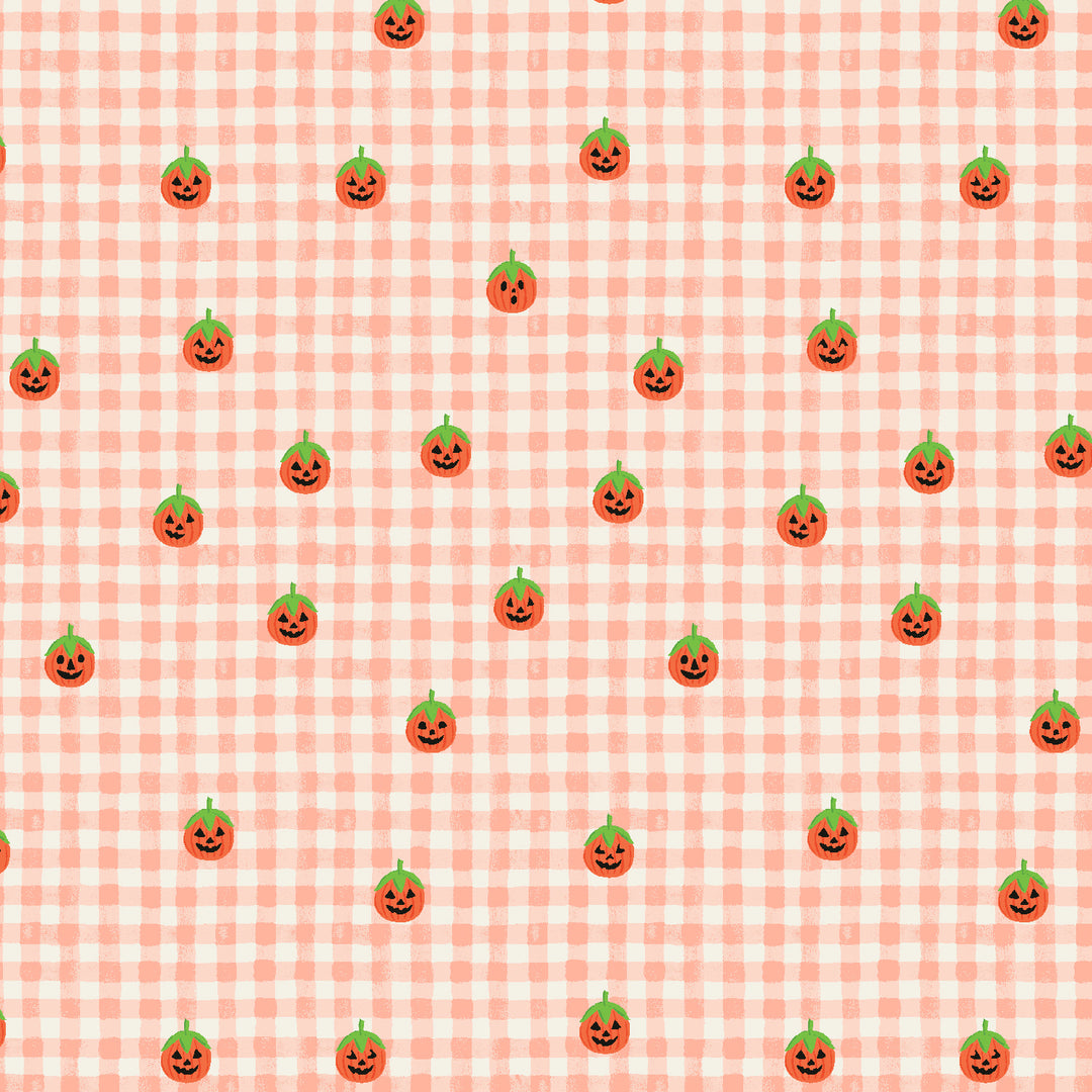 A repeating Halloween pattern featuring small orange jack-o'-lantern faces with green stems on a pale pink and white gingham check background.