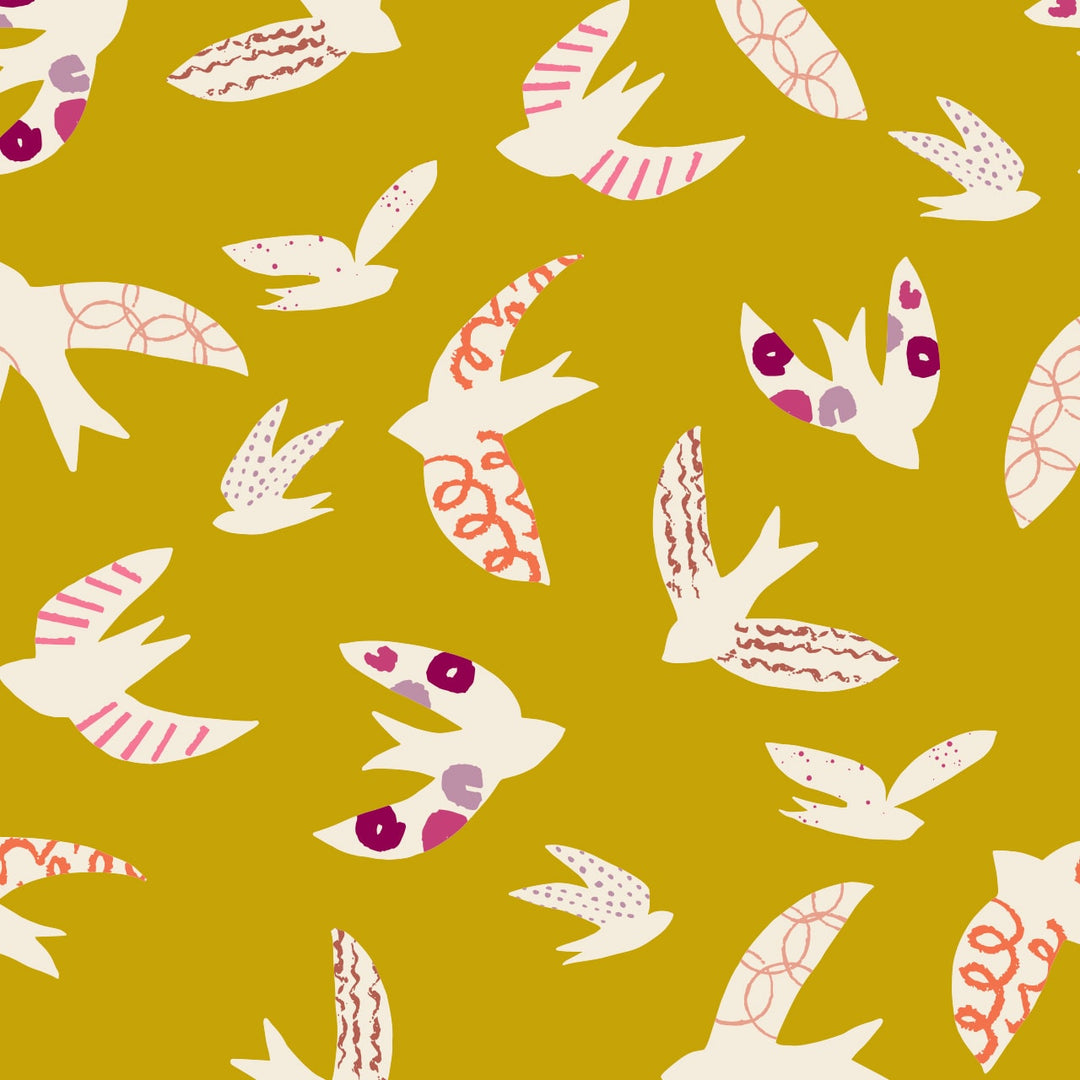 fabric with a gold/mustard background and white birds