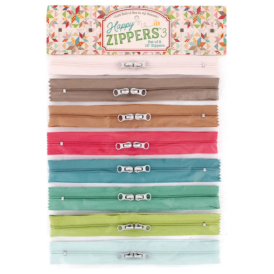 Set of colorful zippers in a Happy Zippers packaging on a white background