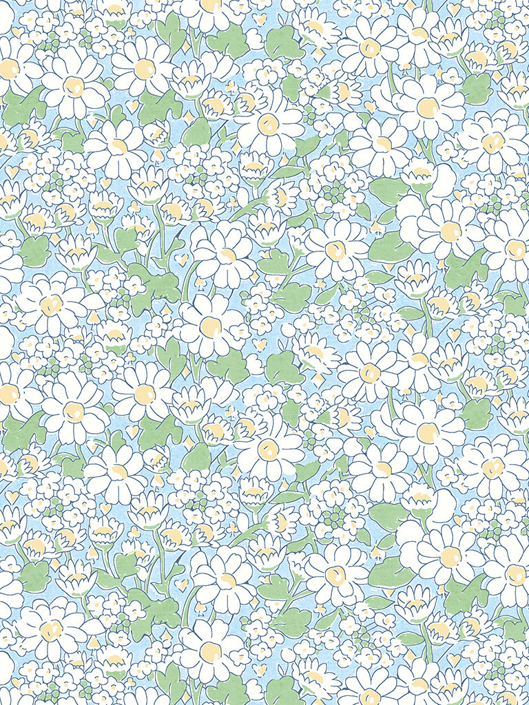 A patterned fabric featuring a floral design with daisies and small playing card symbols.