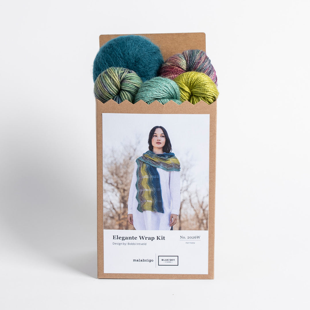 Yarn kit packaging with colorful yarn balls and a photo of a person wearing a scarf.