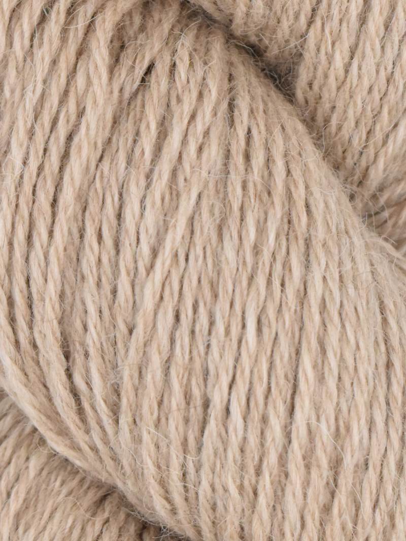 Close-up of beige yarn with a soft texture