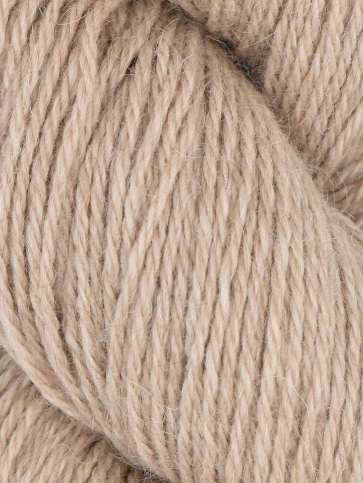 Close-up of beige yarn with a soft texture